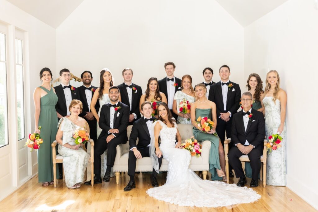 Colorful Wedding Party sitting on a couch at a Hendersonville NC Wedding Photographer